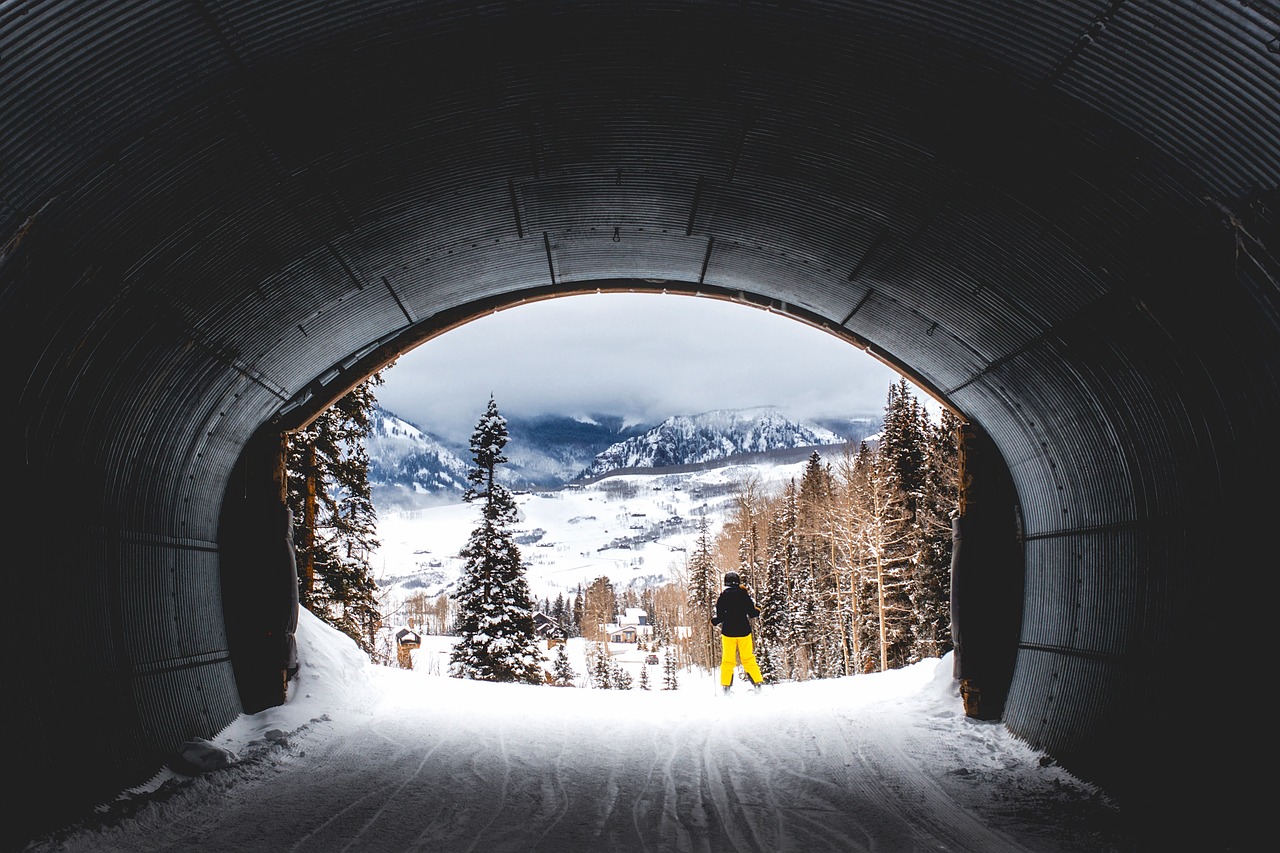 Man going through a ski tunnel