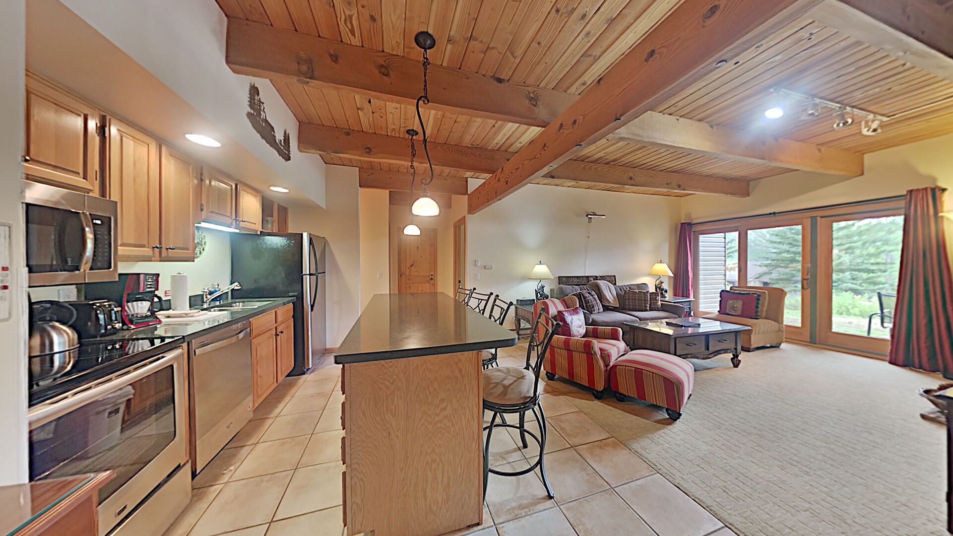 The kitchen and living area of one of our amazing Snowmass CO apartment rentals