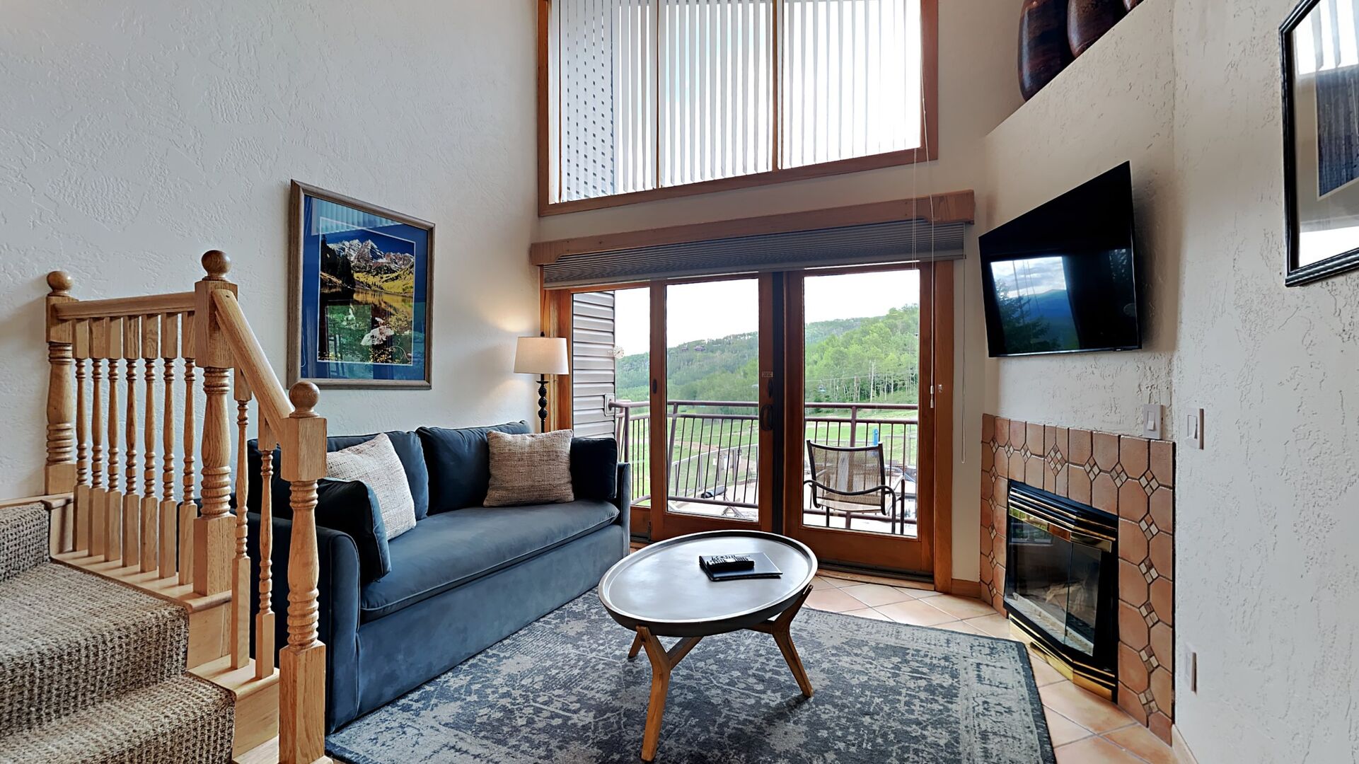 The interior of one of our Snowmass rentals with a fireplace