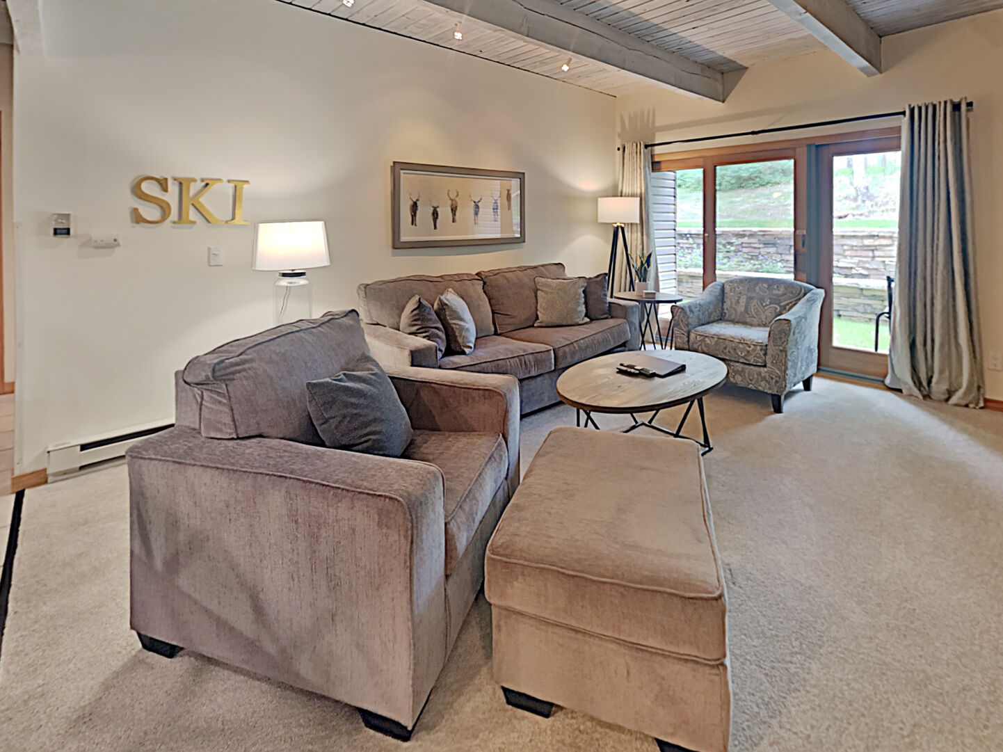 The living room inside of our Snowmass, Colorado rentals with a Jacuzzi